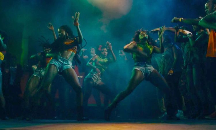Travelers dancing at the Jamaica Carnival Breakfast Party in Kingston